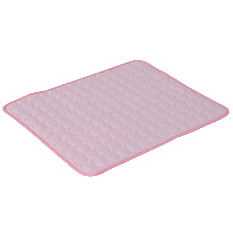 Pink cooling pet mat with raised hex texture and matching light border