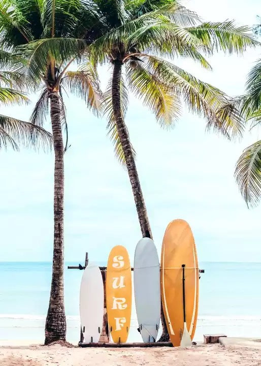 Surfboard canvas print with orange and white boards beside palm trees and ocean