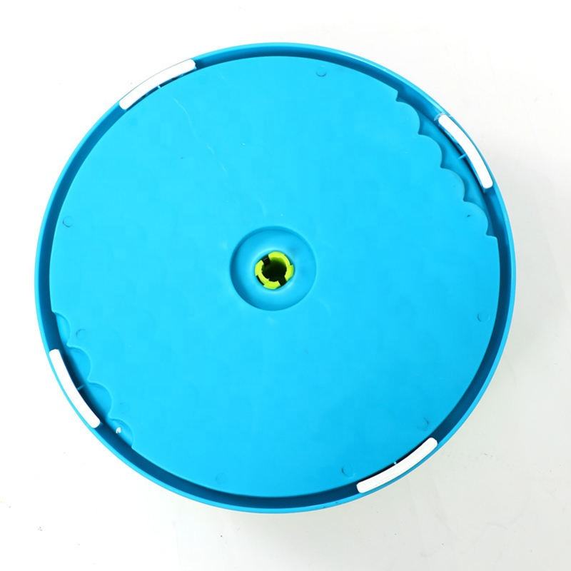 Blue slow feeder puzzle bowl lid with circular spinning hub in center