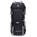 Black hiking backpack with front pocket, side compression straps, and padded harness