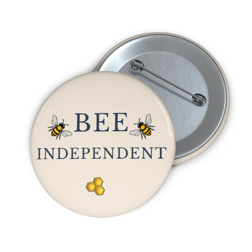 Round bee pin badge, cream, bees, BEE INDEPENDENT text and honeycomb icon
