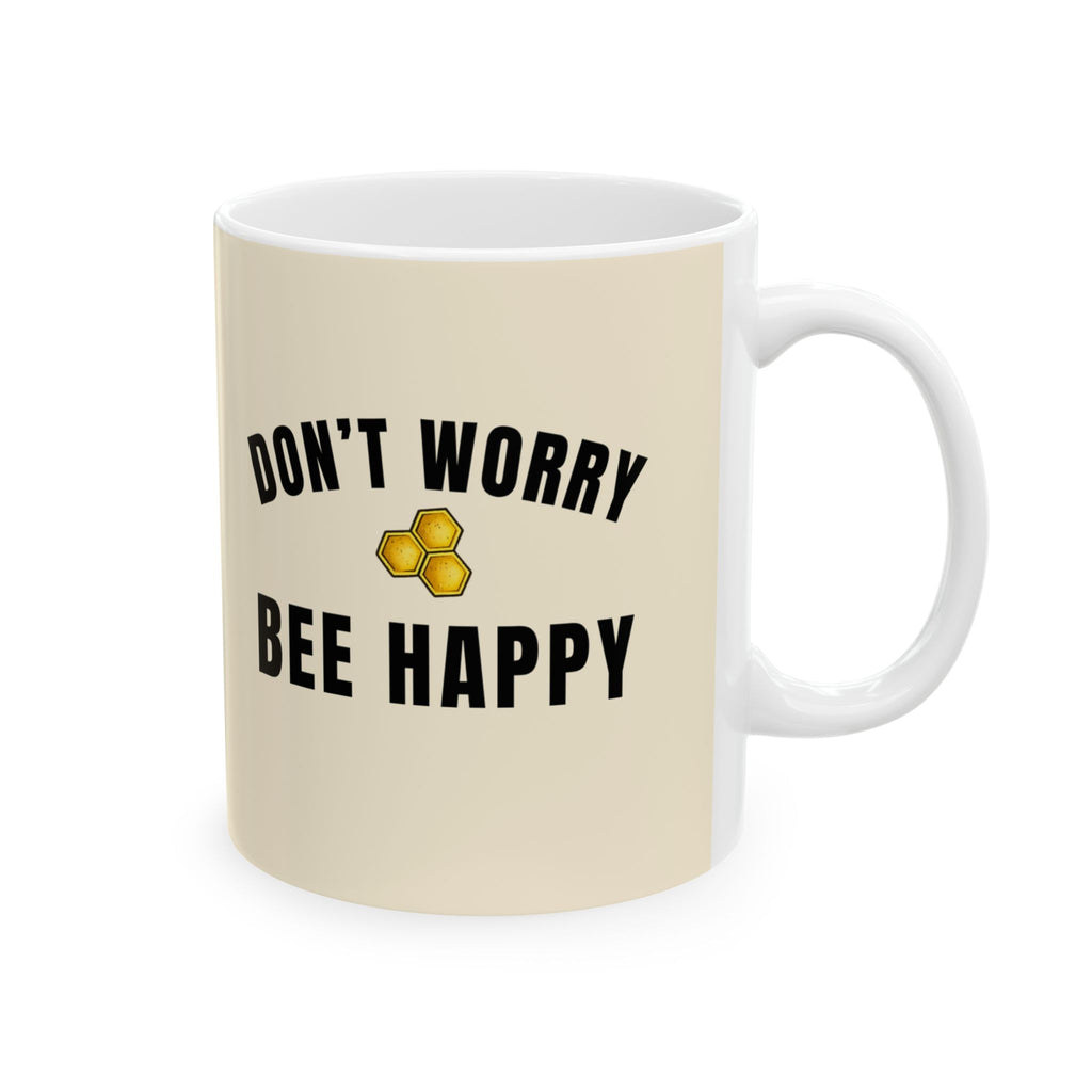 Beige ceramic mug with “DON’T WORRY BEE HAPPY” text and honeycomb icon
