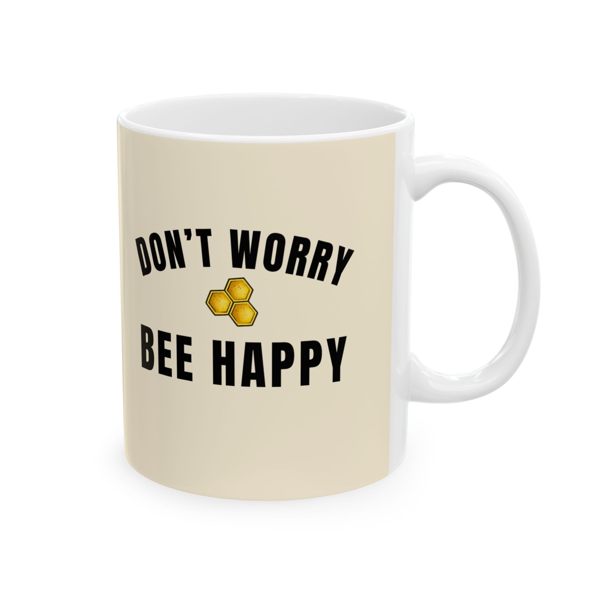 Beige ceramic mug with “DON’T WORRY BEE HAPPY” text and honeycomb icon