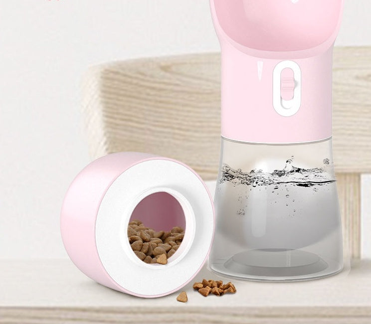 2-in-1 portable pet water and food dispenser in pink with open food cup and kibble
