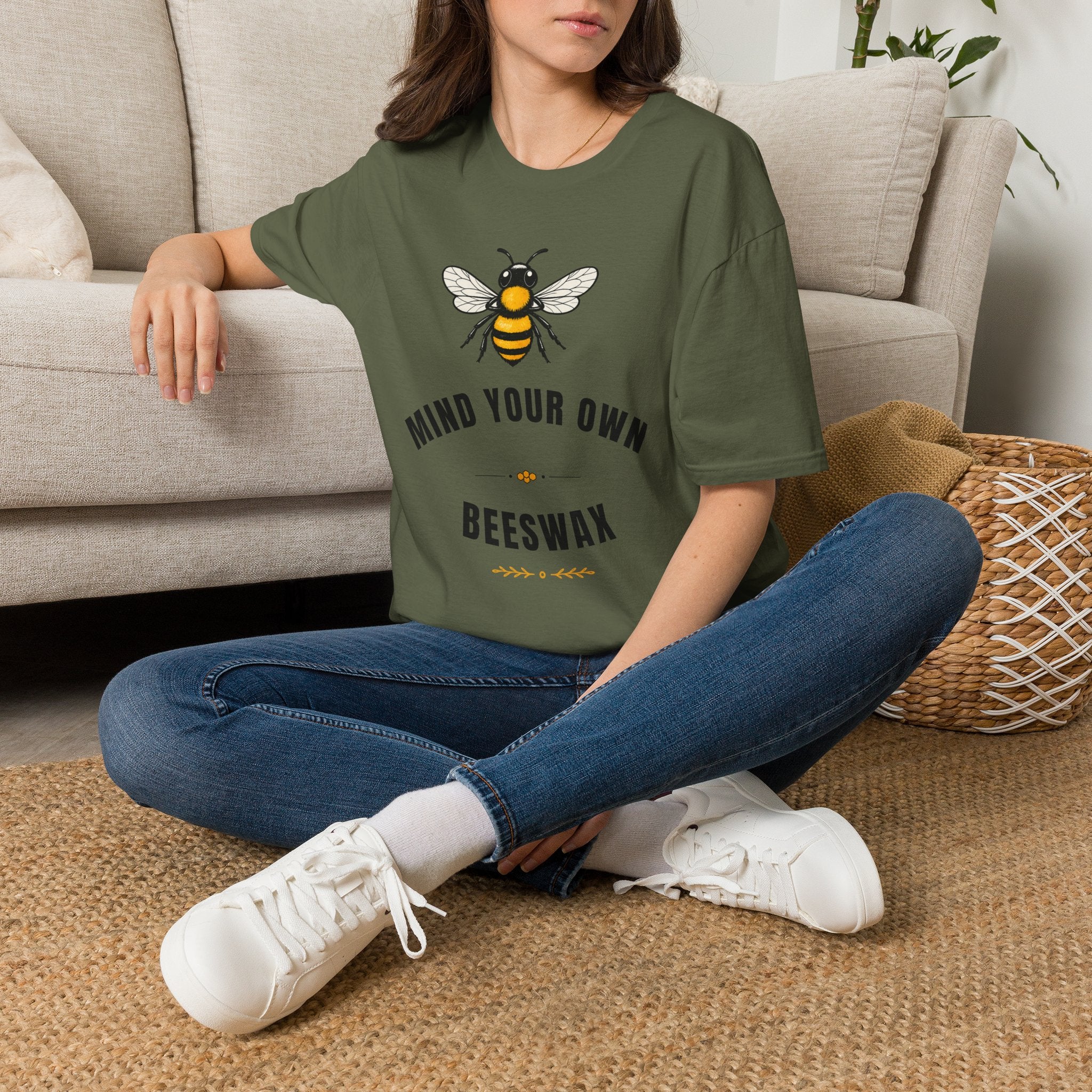 Olive green t-shirt with bee plus “MIND YOUR OWN” and “BEESWAX” text