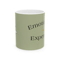 Green ceramic mug with partial black serif text and decorative bee accents