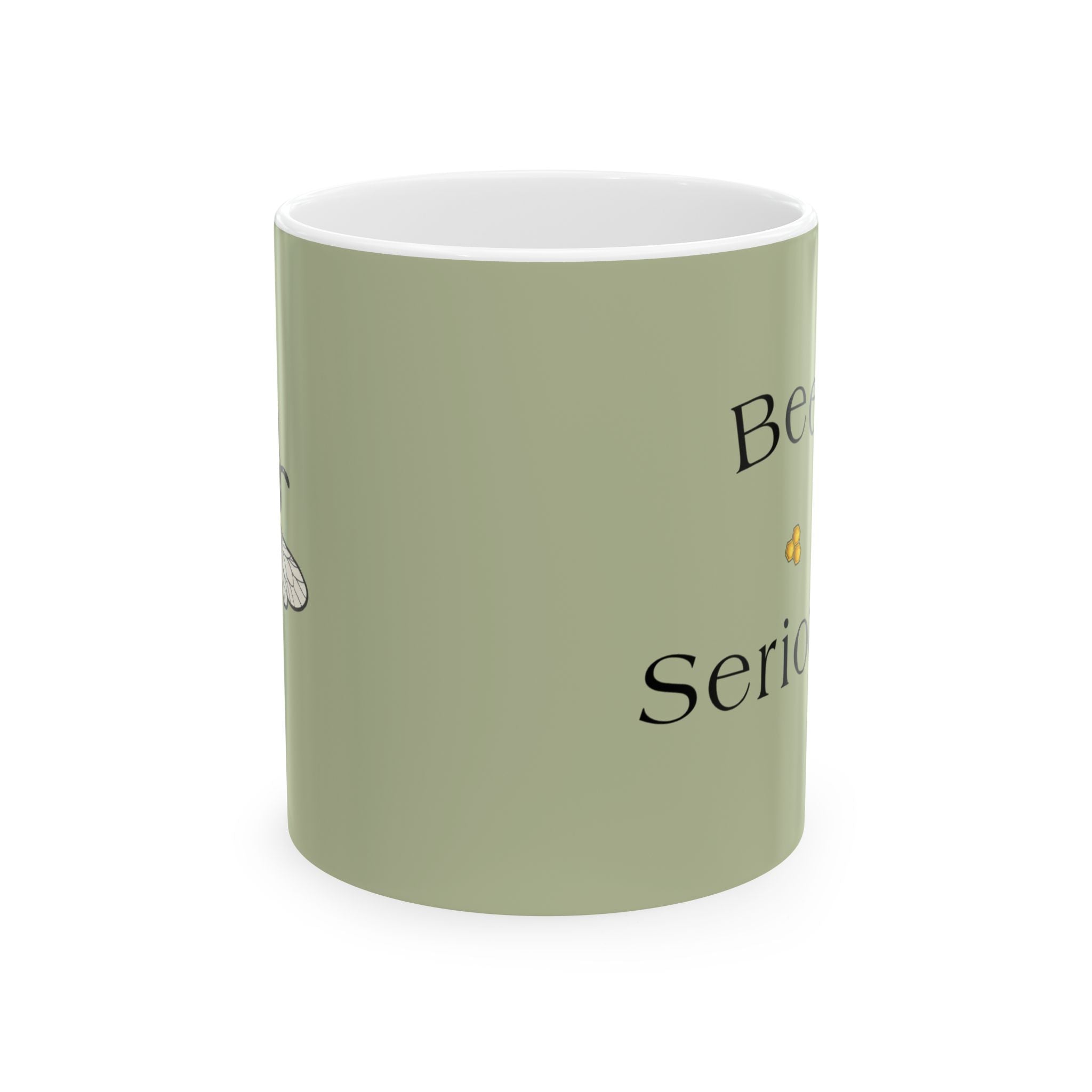 Olive green mug with 'Bee Serious' text and small bee illustration on front