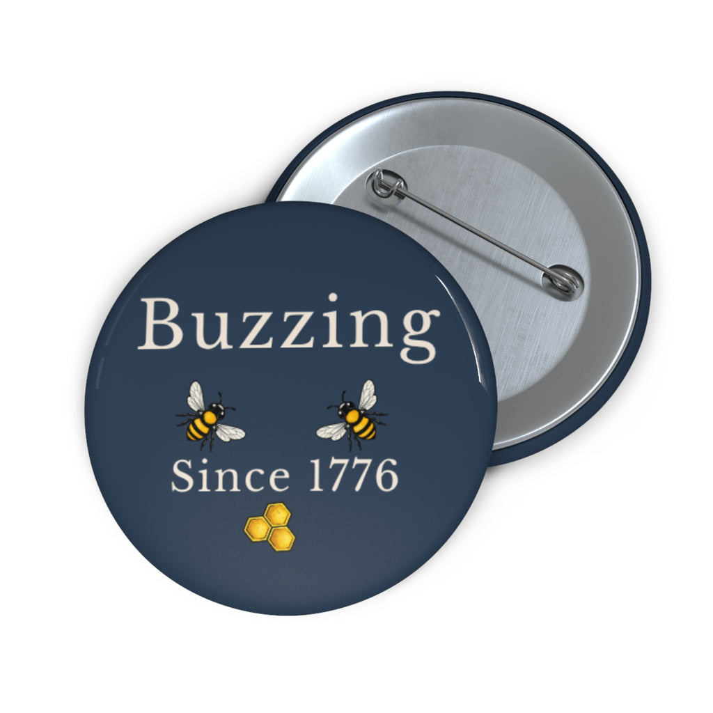 Round pin button front with “Buzzing Since 1776” and two bees, with metal back