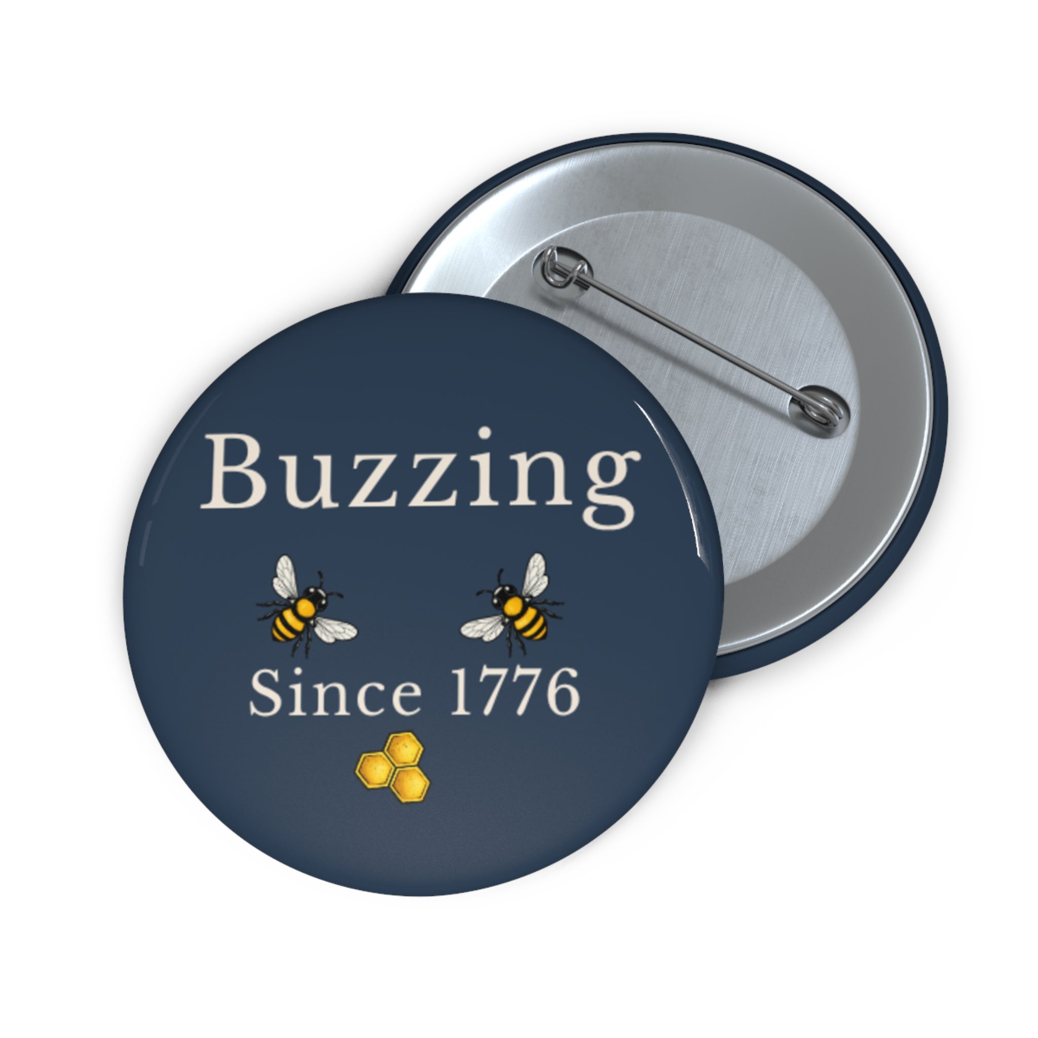 Round pin button front with “Buzzing Since 1776” and two bees, with metal back