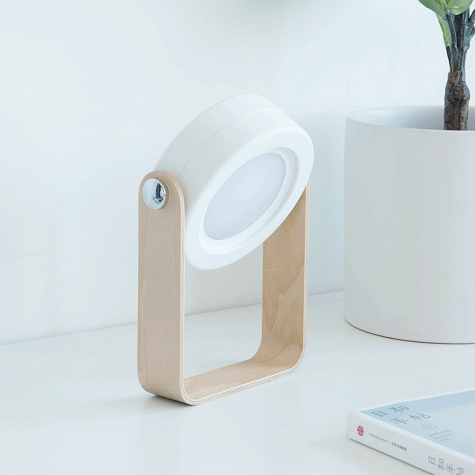 Foldable LED night lantern with white ridged body and wood frame, front lit window