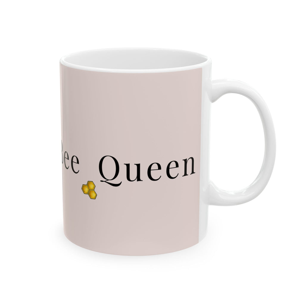 Pink ceramic mug with 'Queen' text and honeybee icon, white handle
