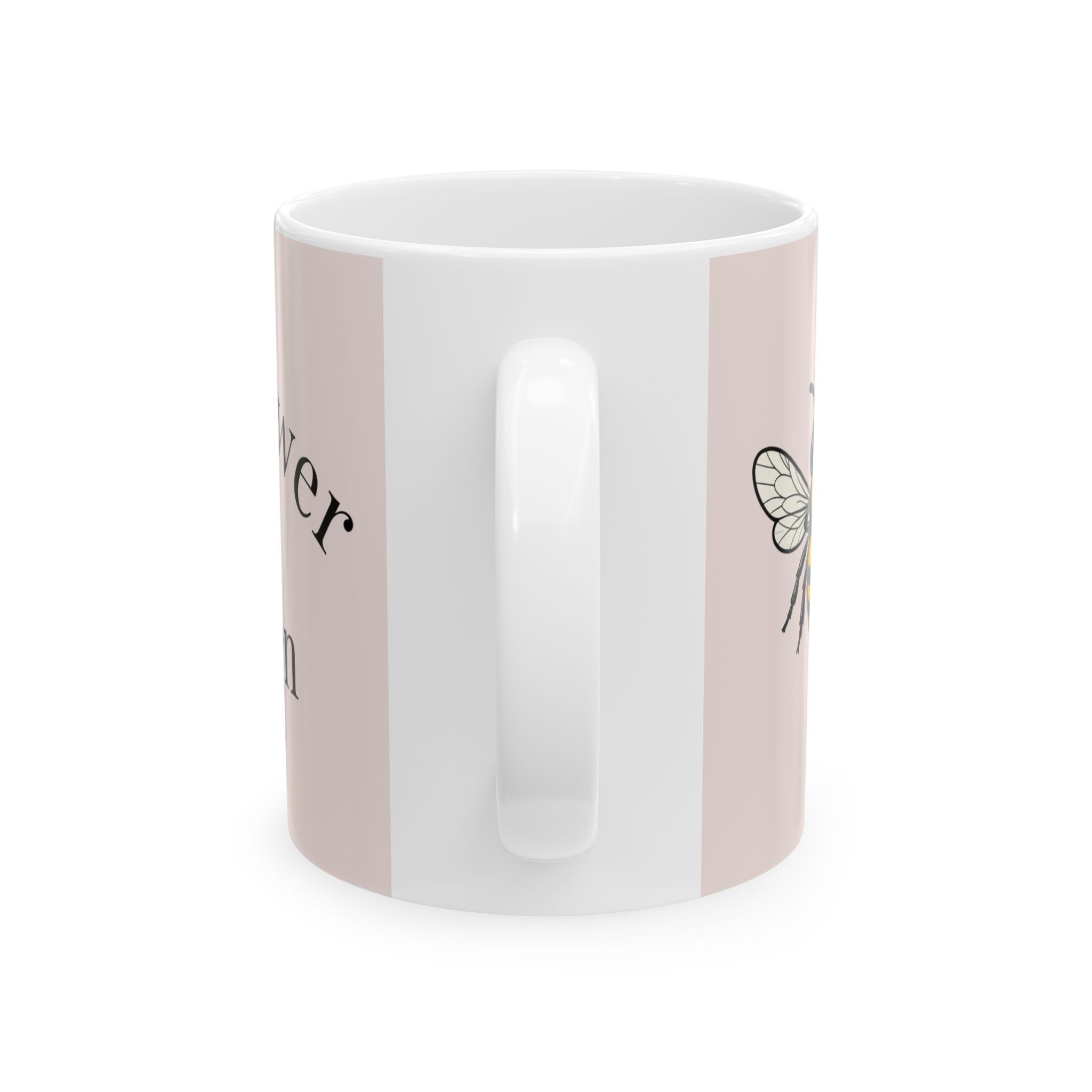 Pink ceramic coffee cup with vertical white panel and partial bee decal