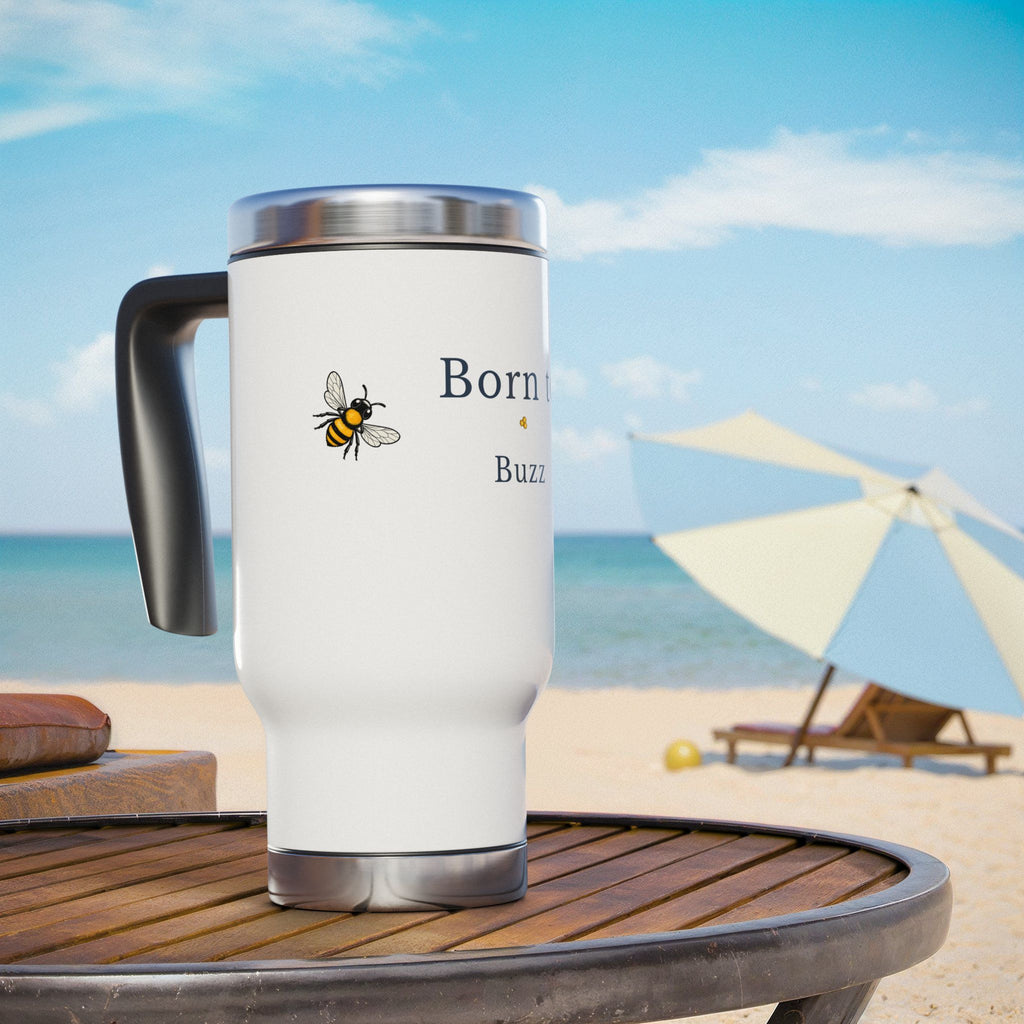 White travel mug with black handle, silver lid, and bee graphic on front