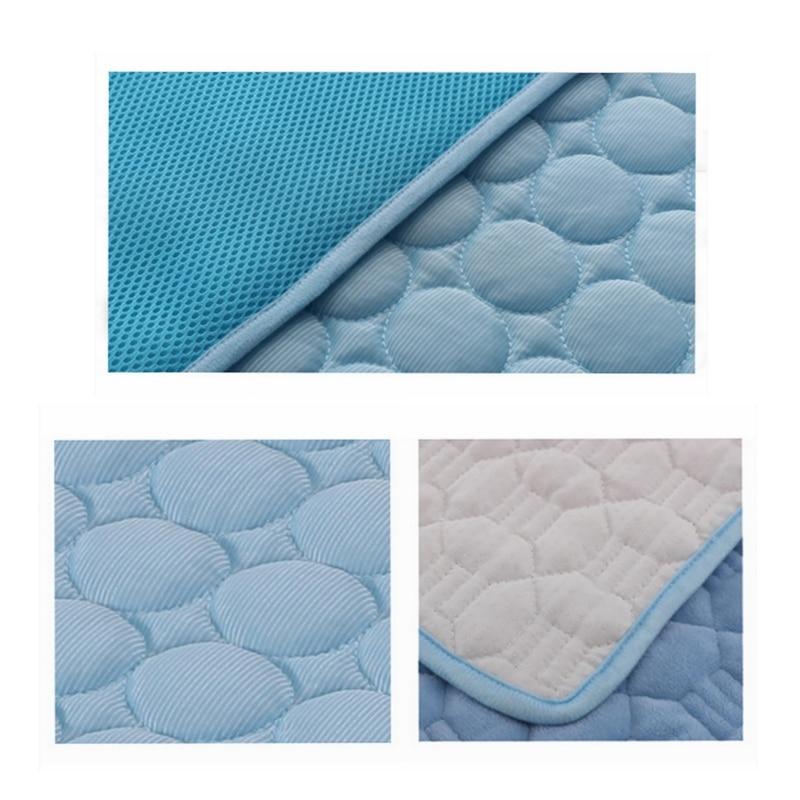 Blue pet cooling nest pad fabric close-up with raised bubble quilt texture