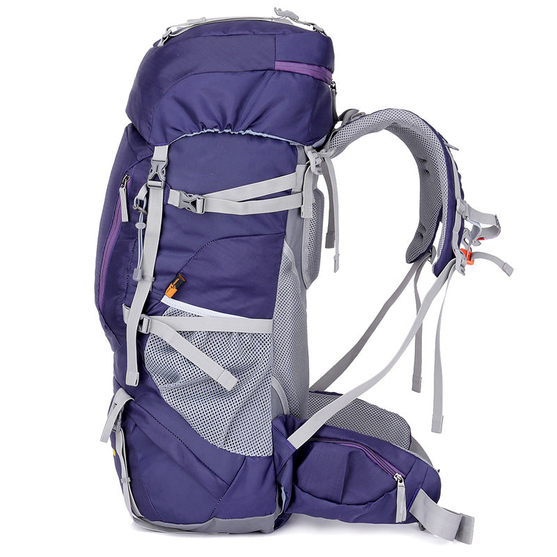 Purple hiking backpack with padded harness, front zip pockets, and side carry straps