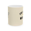 Cream ceramic coffee cup with black motivational text on side