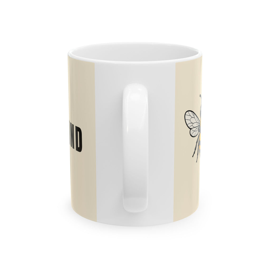 Cream ceramic mug with side bee line art and white handle