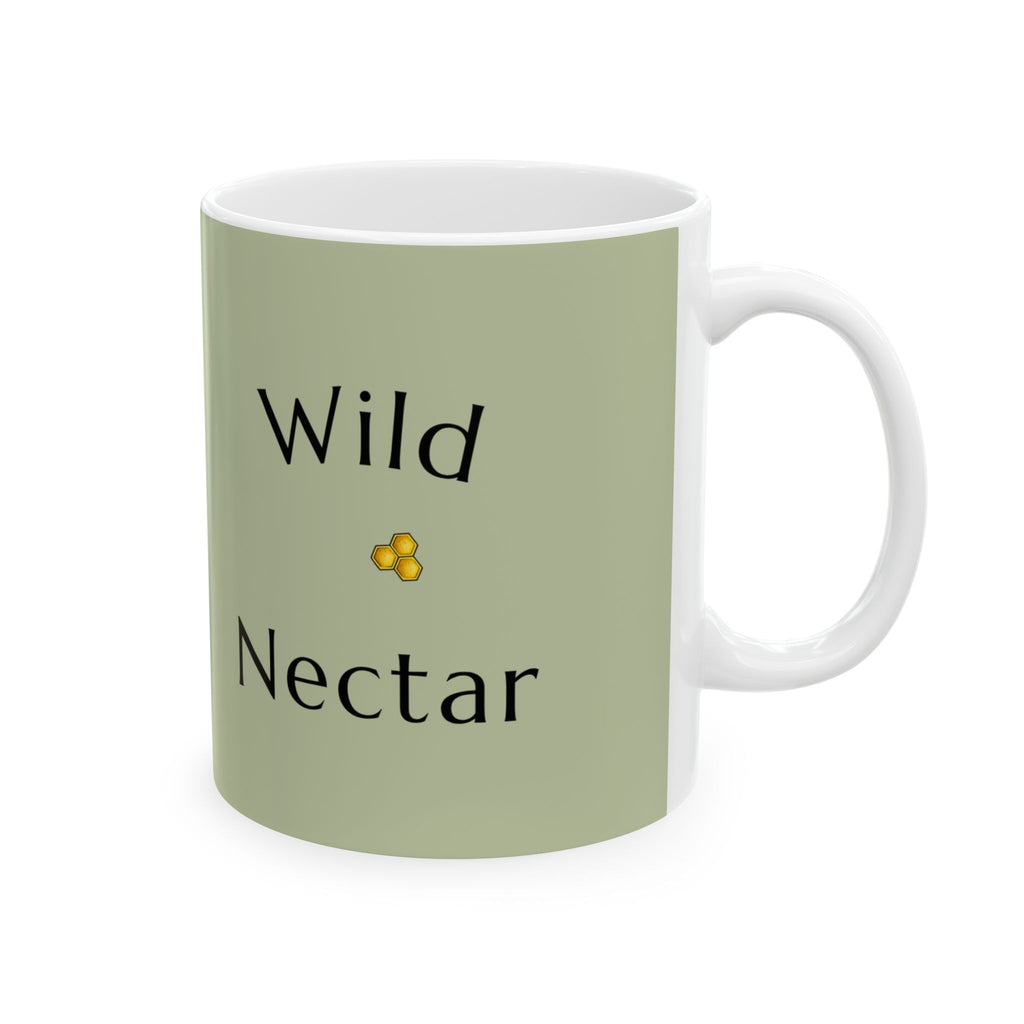Green ceramic mug with “Wild Nectar” lettering and small yellow flower icon