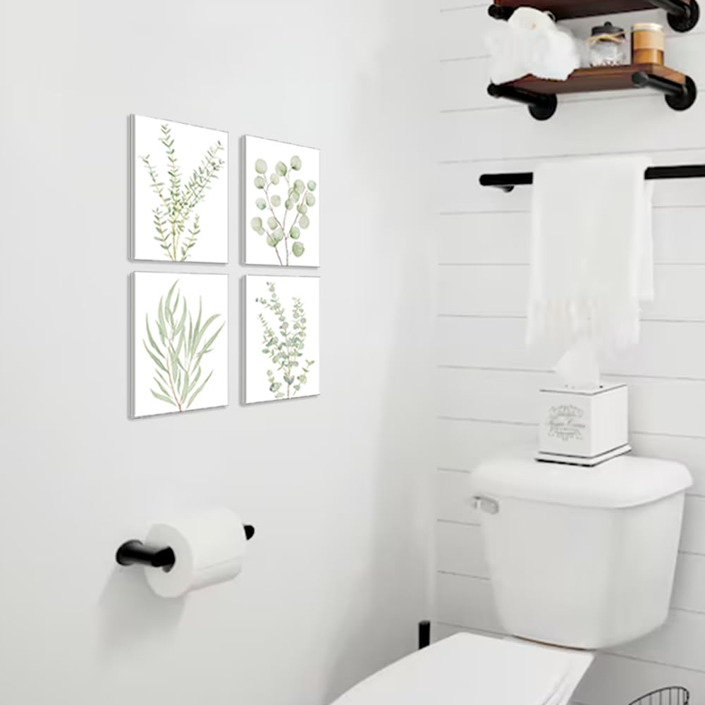Set of 4 framed botanical leaf canvas prints arranged on a wall