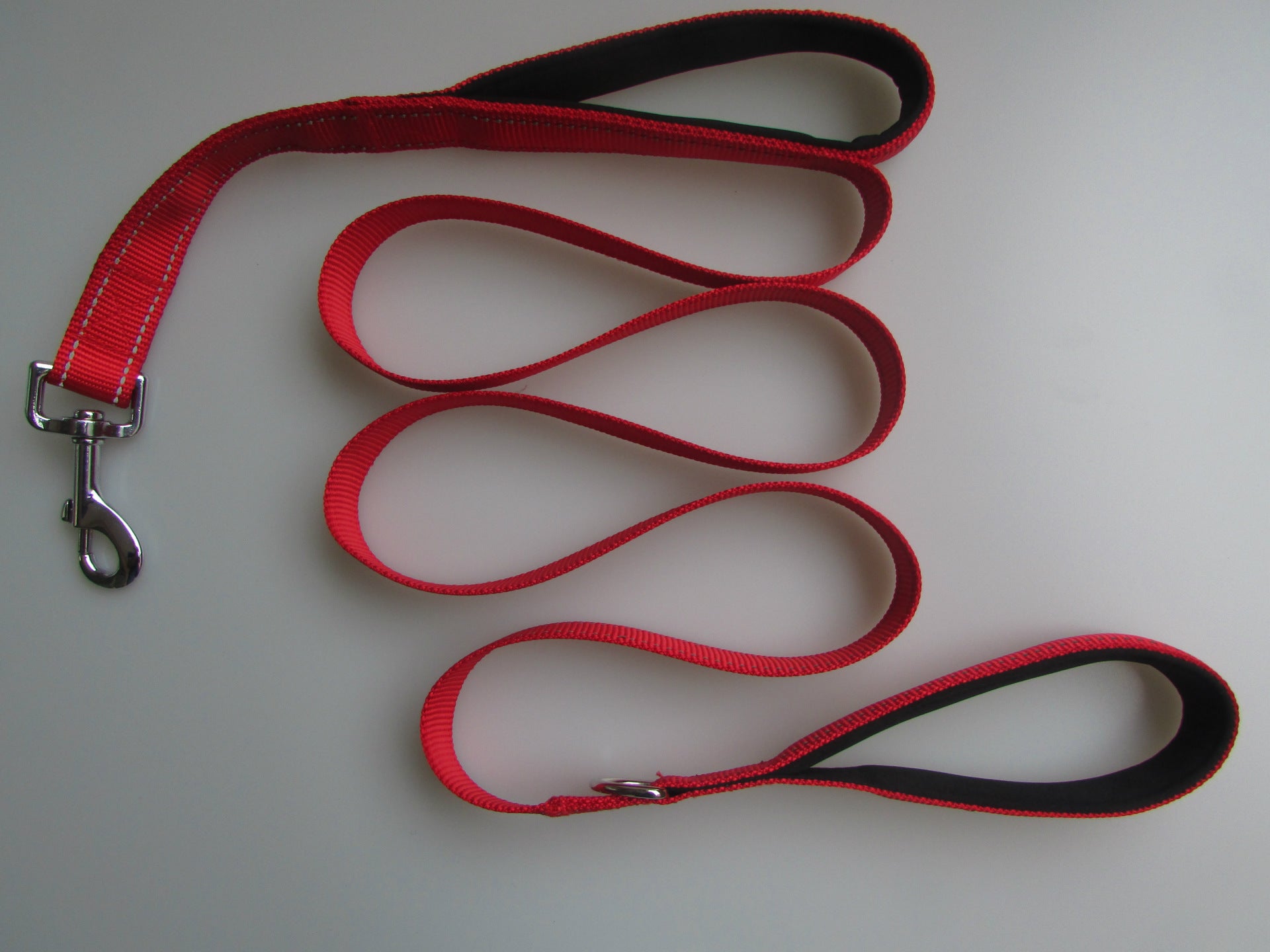Double-handle dog leash with reflective accents, red webbing with black trim and clips
