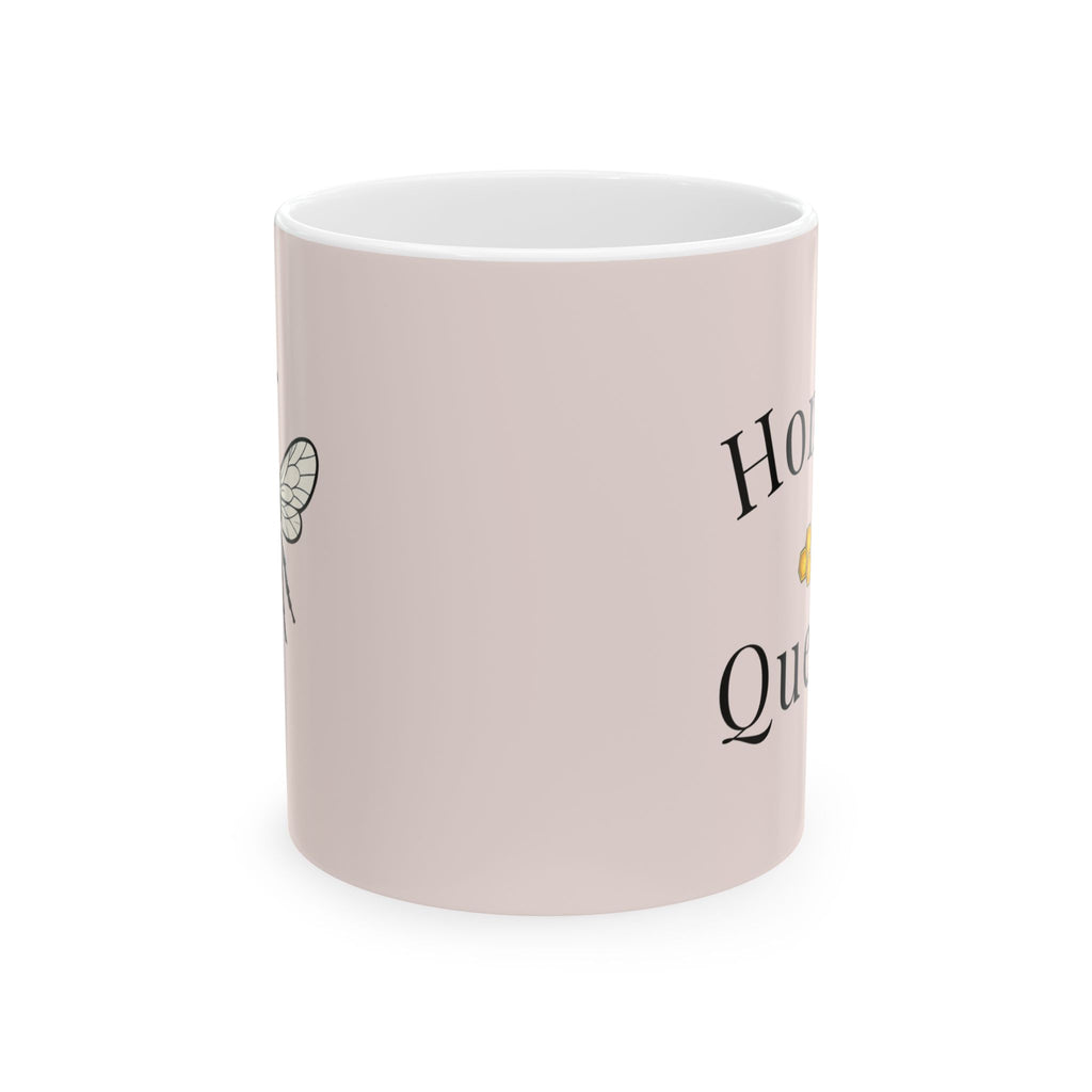 Light pink mug with black-and-yellow bee graphic on side