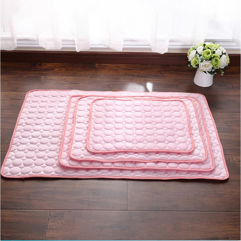 Pink pet cooling nest pad with quilted bubble texture, flat centered view