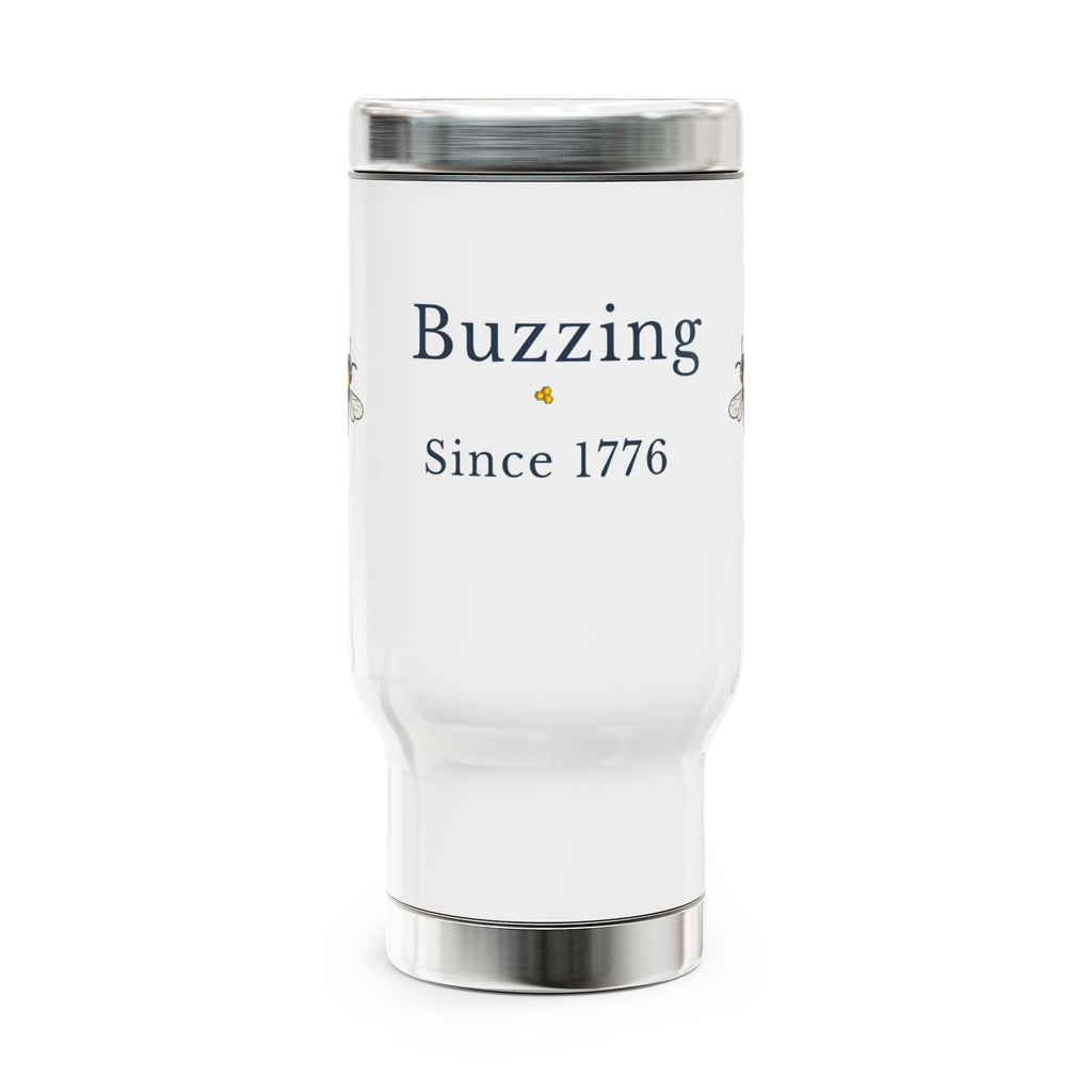 White travel mug with 'Buzzing Since 1776' text on front, stainless steel base and lid