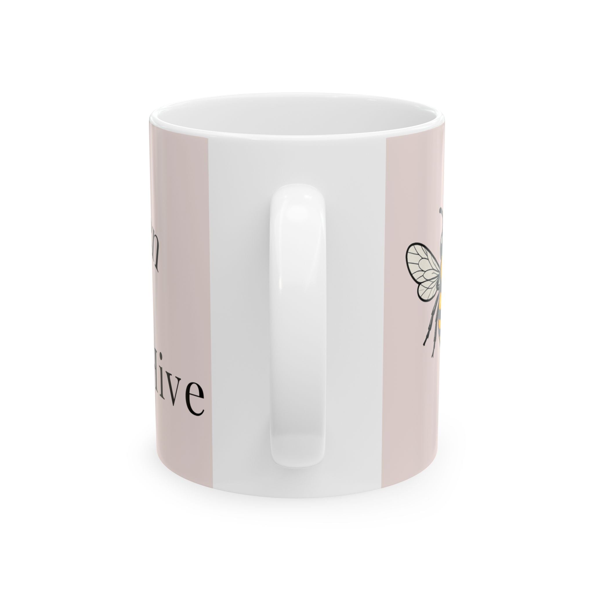 Light pink mug with white interior and bee illustration on side