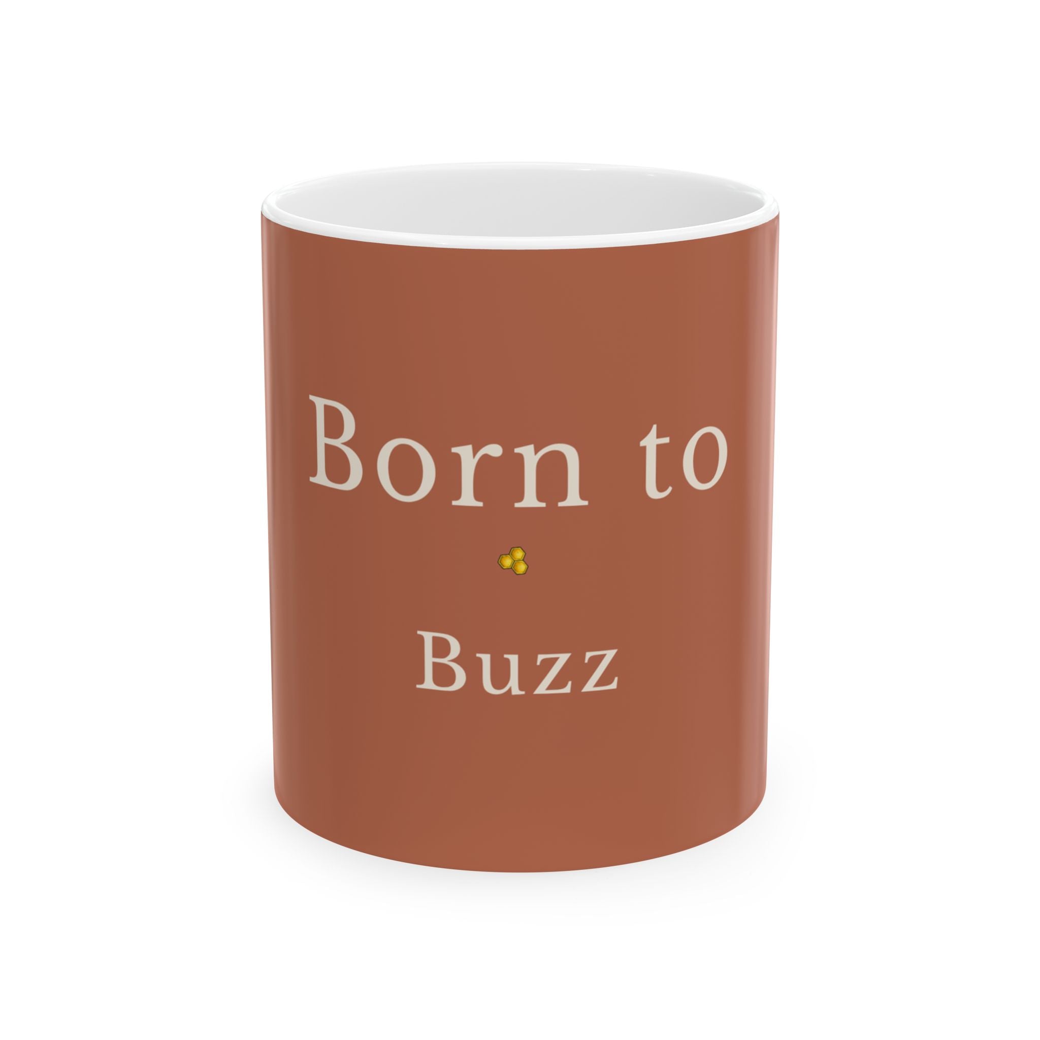 Brown ceramic mug with “Born to Buzz” text and small yellow bee graphic