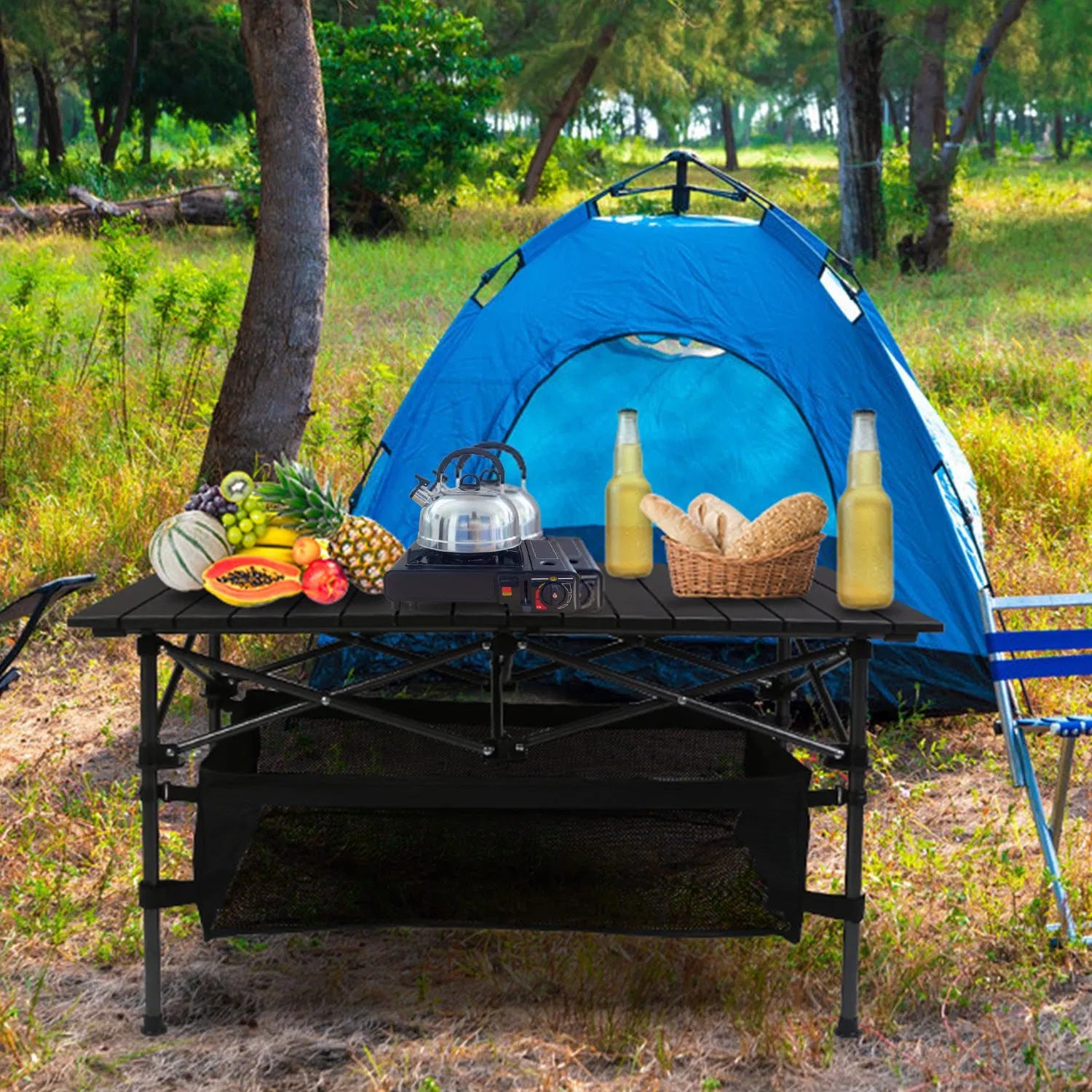 Black folding camping table with ribbed top and black mesh storage basket