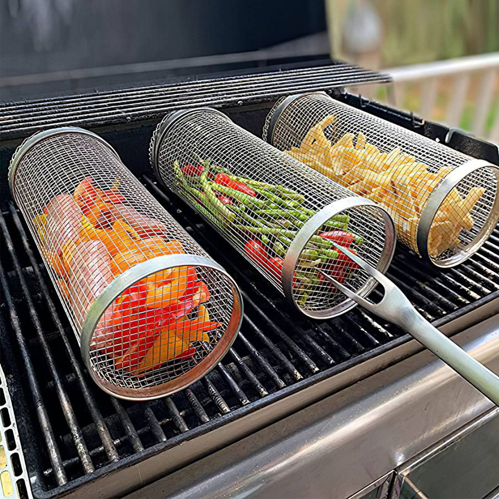 Stainless steel round grill baskets on grates with wire mesh cylinders holding food