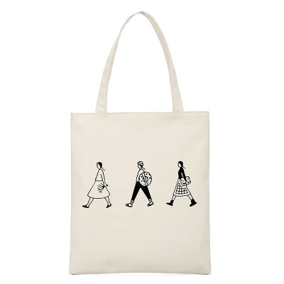 White canvas tote bag with three black line-art fashion figures