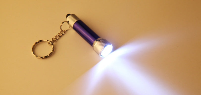 Purple mini aluminum LED keychain flashlight with silver textured head and chain keyring