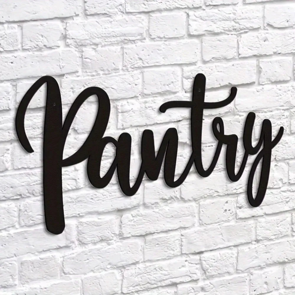 Metal pantry wall sign with cursive “Pantry” in black on white brick