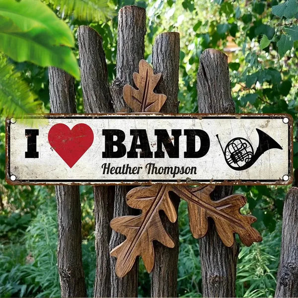 Vintage aluminum wall sign with 'I ♥ BAND' lettering and red heart icon