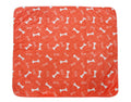 Orange waterproof pet training pad, white bone icons pattern, rounded corners