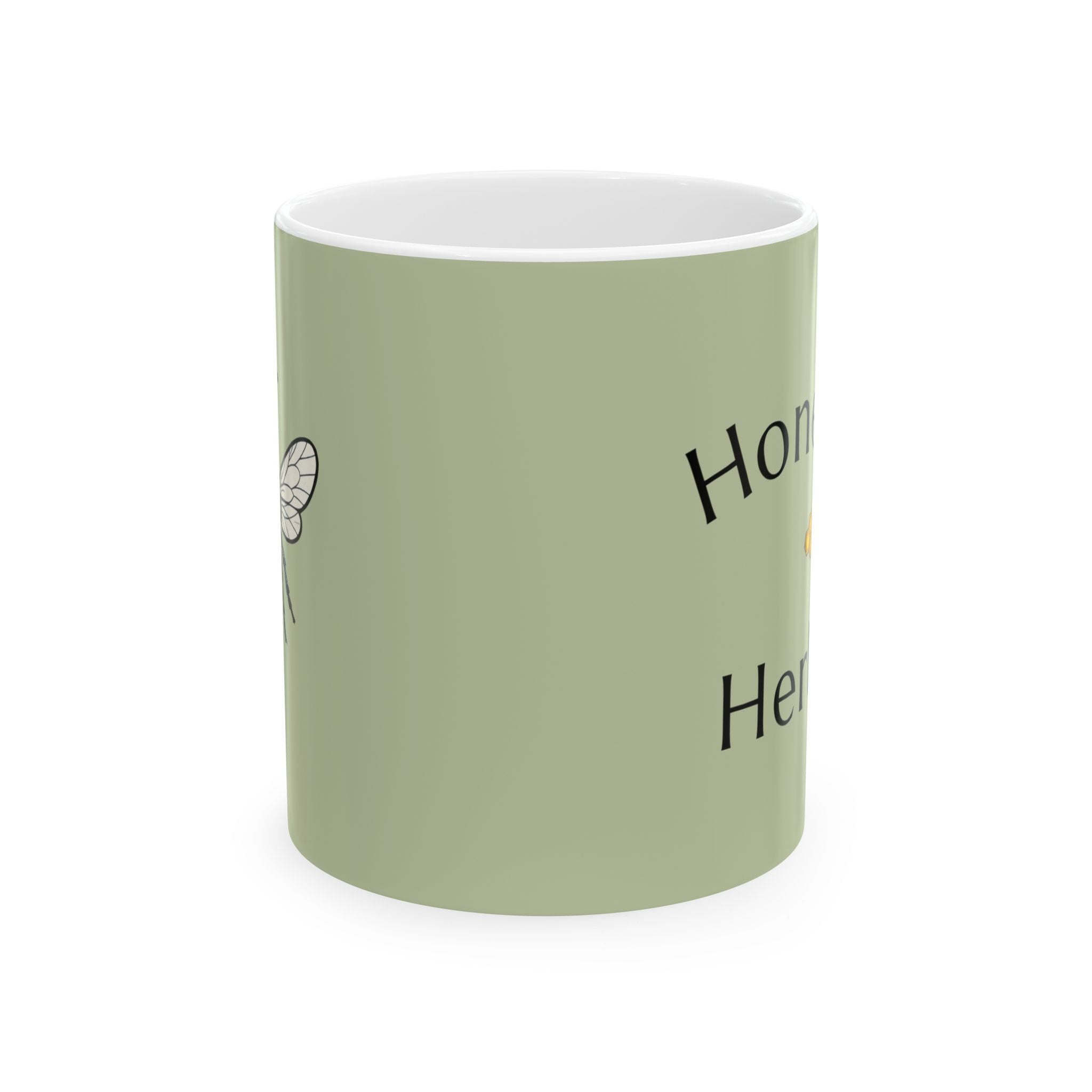 Green mug with white rim and partial honey herbs text print