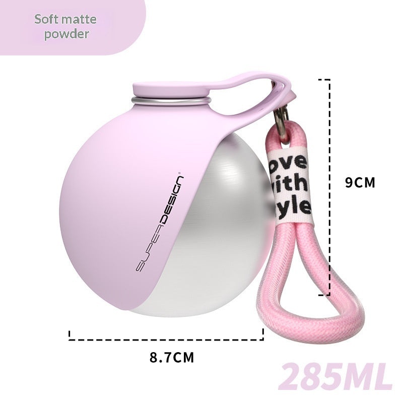 Soft mist pink stainless steel pet water cup with handle, waste bag dispenser, and pink strap.