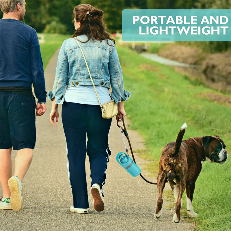 Dog poop scooper kit on a walk, with light blue dispenser and gray scoop arms