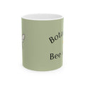 Botanical bee mug, light green with partial 'Botanical' and 'Bee' lettering