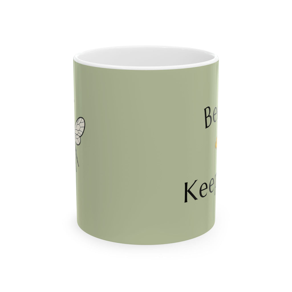 Green bee-themed mug with partial black text and small winged bee icon