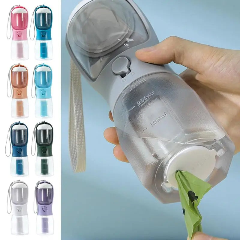 Portable pet travel cup with clear chamber and bag insert, held by hand