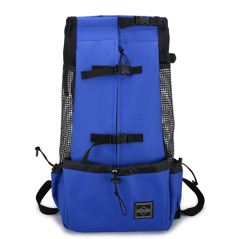 Blue pet carrier backpack with black mesh side panels, top handle, and front storage pouch