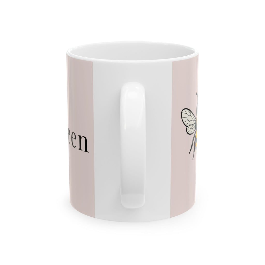 Pink and white ceramic mug with handle, featuring bee wing design