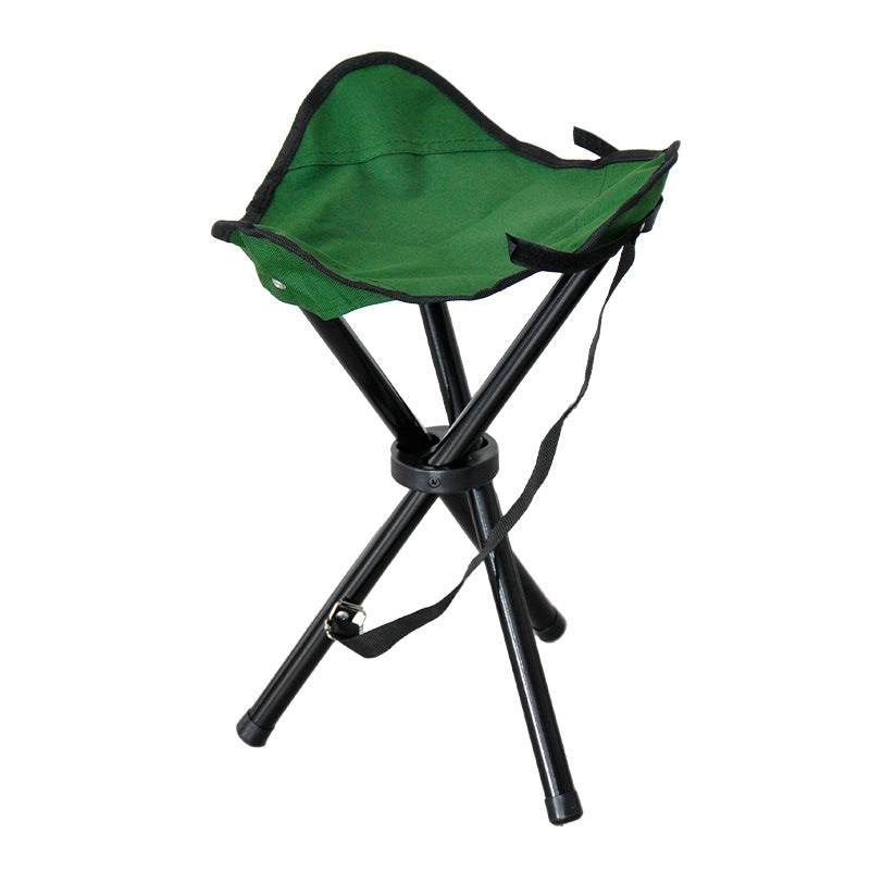 Green folding tripod stool with fabric seat and adjustable carrying strap