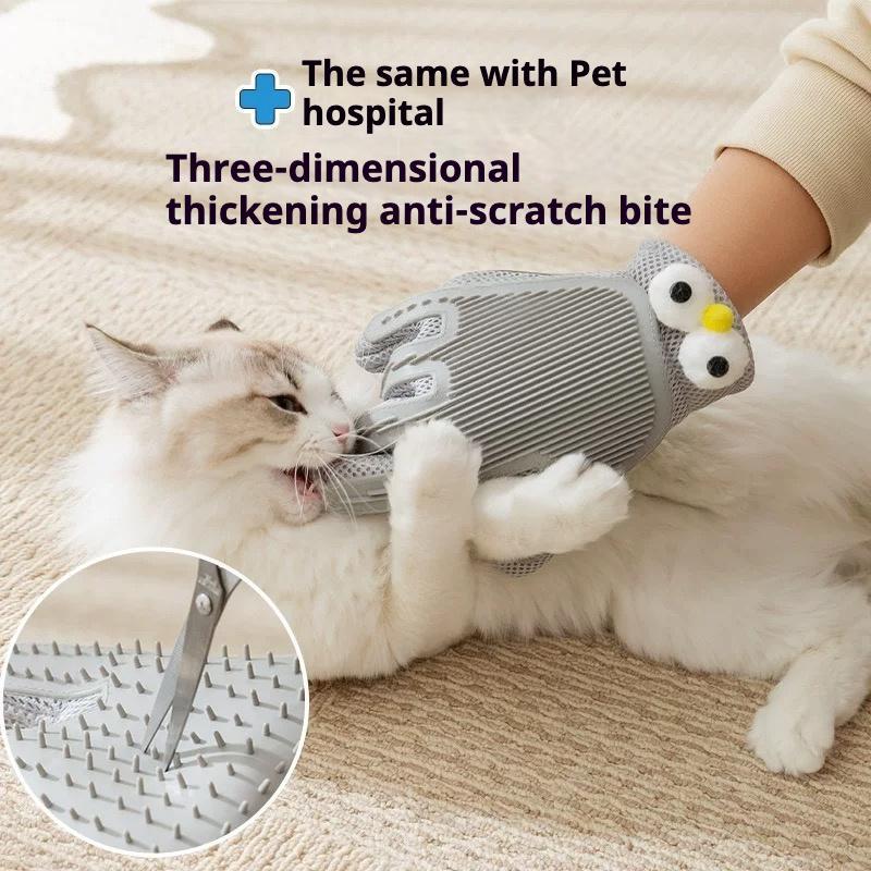 Gray pet grooming glove worn on hand, grooming a cat with silicone bristles