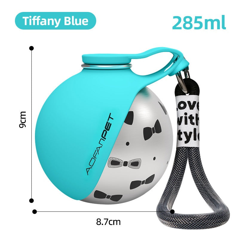 Tiffany blue stainless steel pet water cup with paw graphic, handle, and waste bag dispenser, black strap.