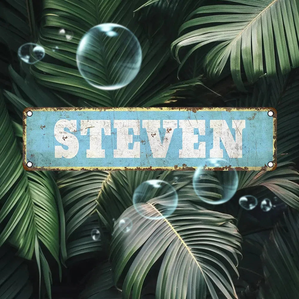 Vintage aluminum name plate sign reading STEVEN, blue distressed finish, metal border.