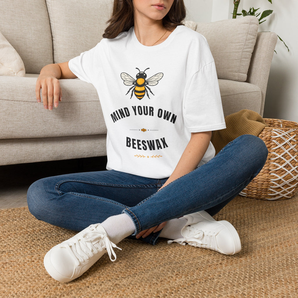 White t-shirt with bee graphic and "MIND YOUR OWN" and "BEESWAX" text on front