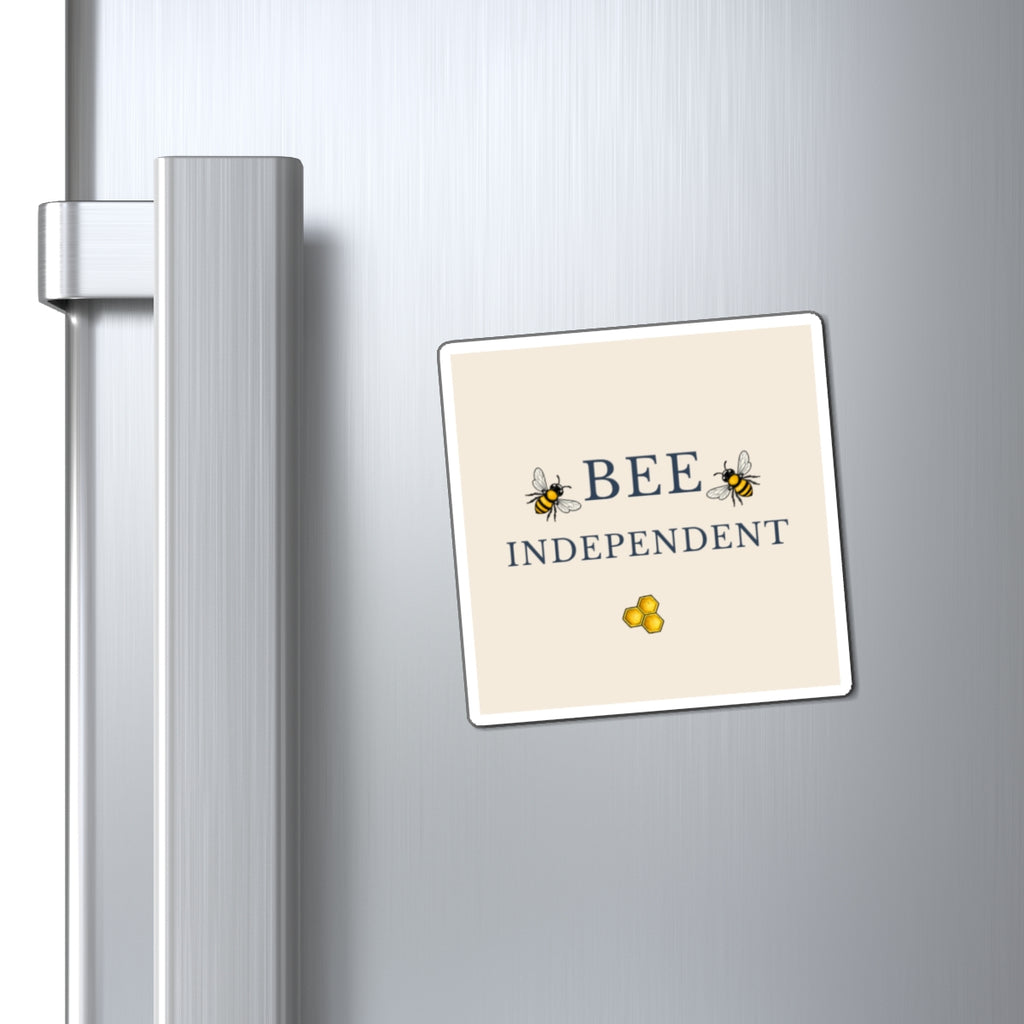 Bee-themed refrigerator magnet attached to metal fridge, showing 'BEE INDEPENDENT'
